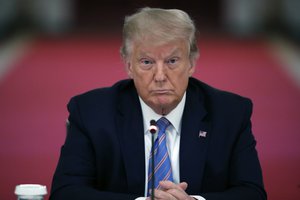 FILE - President Donald Trump listens during a "National Dialogue on Safely Reopening America's Schools," event in the East Room of the White House, Tuesday, July 7, 2020, in Washington.