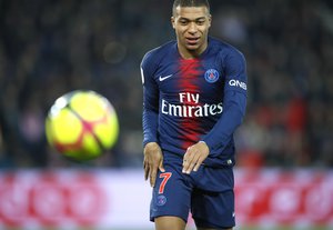 Kylian Mbappe follows the ball during the French League One soccer match between Paris Saint Germain and Montpellier