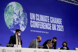 Alok Sharma, centre seated, President of the COP26 summit attends a stocktaking plenary session at the COP26 U.N. Climate Summit, in Glasgow, Scotland, Saturday, Nov. 13, 2021.