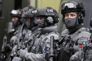 Police counter terrorism officers during a media opportunity in London, Wednesday, Aug. 3, 2016.