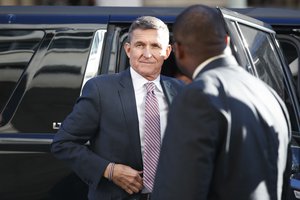 President Donald Trump's former National Security Advisor Michael Flynn arrives at federal court in Washington, Tuesday, Dec. 18, 2018. President Donald Trump has pardoned Michael Flynn, taking direct aim in the final days of his administration at a Russia investigation that he has long insisted was motivated by political bias. Trump announced the pardon on Wednesday, Nov. 25, 2020 calling it his “Great Honor.