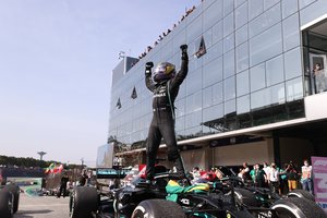 Mercedes driver Lewis Hamilton, of Britain, celebrates his victory in the Brazilian Formula One Grand Prix in Sao Paulo, Brazil, Sunday, Nov. 14, 2021.