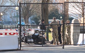 Members of the National Guard secure the perimeter around the Capitol in Washington DC