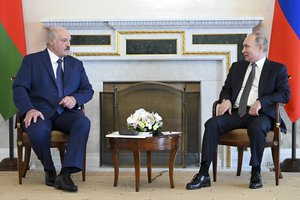 Russian President Vladimir Putin, right, and Belarusian President Alexander Lukashenko meet in St. Petersburg, Russia, Tuesday, July 13, 2021.