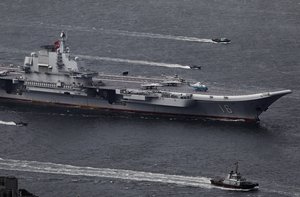 In this July 7, 2017, file photo, the Liaoning, China's first aircraft carrier, sails into Hong Kong for a port call to celebrate the 20th anniversary of the People's Liberation Army (PLA) garrison's presence in the semi-autonomous Chinese city and former British colony