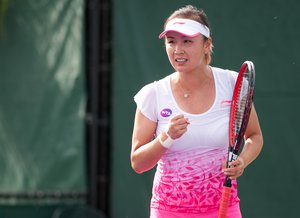 Shuai Peng (CHN) competes against Alison Van Uytvanck (BEL) at the 2016 Miami Open presented by Itau in Key Biscayne, Florida. Photographer Aaron Gilbert