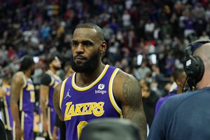 Los Angeles Lakers forward LeBron James is ejected after fouling Detroit Pistons center Isaiah Stewart during the second half of an NBA basketball game, Sunday, Nov. 21, 2021, in Detroit.