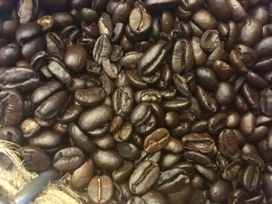 Coffee beans on display at a cafe, pressed and brewed fresh for coffee. Taken on August 2018.