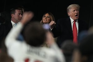 Former President Donald Trump and his wife Melania arrive for Game 4 of baseball's World Series between the Houston Astros and the Atlanta Braves Saturday, Oct. 30, 2021, in Atlanta.