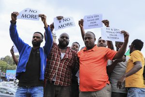 Ethiopians protest against the United States outside the U.S. embassy in the capital Addis Ababa, Ethiopia Thursday, Nov. 25, 2021.