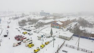 Ambulances and fire trucks are parked near the Listvyazhnaya coal mine out of the Siberian city of Kemerovo, about 3,000 kilometres (1,900 miles) east of Moscow, Russia, Thursday, Nov. 25, 2021