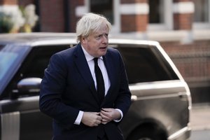 Britain's Prime Minister Boris Johnson arrives at Westminster Cathedral to attend the funeral of slain member of parliament David Amess, in London, Tuesday, Nov. 23, 2021