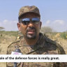 Ethiopian PM Abiy Ahmed, dressed in military uniform, speaks to a television camera at an unidentified location.