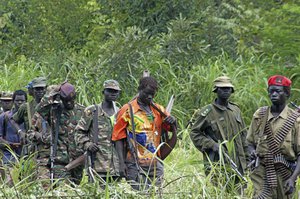 FILE - In this July 31, 2006 file photo, members of Uganda's Lord's Resistance Army (LRA) are seen as their leader Joseph Kony meets with a delegation of Ugandan officials and lawmakers and representatives from non-governmental organizations, in the Democratic Republic of Congo near the Sudanese border.