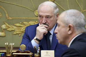 Belarusian President Alexander Lukashenko attends a meeting in Minsk, Belarus, Monday, Nov. 22, 2021.