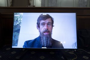 Twitter CEO Jack Dorsey appears on a screen as he speaks remotely during a hearing before the Senate Commerce Committee on Capitol Hill, Wednesday, Oct. 28, 2020, in Washington.