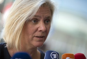 Swedish Finance Minister Magdalena Andersson speaks with the media as she arrives for a meeting of EU finance ministers at the European Council building in Luxembourg on Friday, Sept. 11, 2015