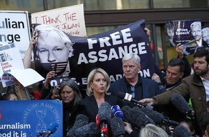 File - Kristinn Hrafnsson, editor of WikiLeaks, center right, and barrister Jennifer Robinson speak to the media outside Westminster magistrates court where WikiLeaks founder Julian Assange was appearing in London, Thursday, April 11, 2019.