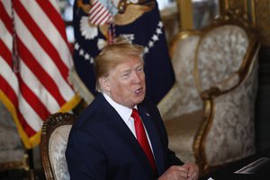 President Donald Trump speaks during a Christmas Eve video teleconference with members of the military at his Mar-a-Lago estate in Palm Beach, Fla., Tuesday, Dec. 24, 2019.