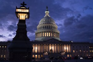 Night falls at the the Capitol in Washington, Thursday, Dec. 2, 2021, with the deadline to fund the government approaching