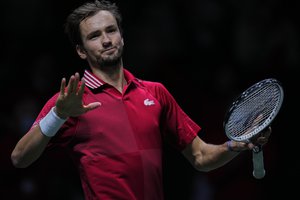 Russian Tennis Federation's Daniil Medvedev celebrates his team victory after defeating Germany's Jan-Lennard Struff during their Davis Cup tennis semi-final match at the Madrid Arena stadium in Madrid, Spain, Saturday, Dec. 4, 2021