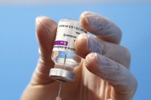 FILE - In this Feb. 11, 2021, file photo, a health worker prepares a dose of the AstraZeneca vaccine to be administered at a vaccination center set up in Fiumicino, near Rome's international airport.