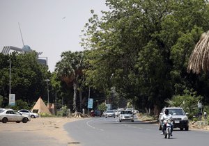 Traffic moves on a street in Sudan's capital Khartoum, Tuesday, Sept. 21, 2021.