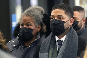 Actor Jussie Smollett arrives Tuesday, Dec. 7, 2021, with his mother Janet, at the Leighton Criminal Courthouse for day six of his trial in Chicago.