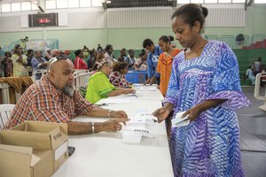 ADDS CITY - A woman participates in a referendum in Noumea, New Caledonia, Sunday, Oct. 4, 2020