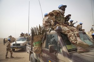 Chadian UN peacekeepers patrol the area outside the Chadian Base where the military delegation from Bamako is meeting with Commander of Chadian UN peacekeepers Gen. Moussa in Tessalit, North of Mali. Photo MINUSMA/Marco Dormino