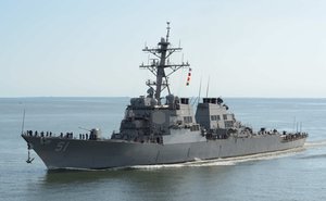 The guided-missile destroyer USS Arleigh Burke (DDG 51) transits the Chesapeake Bay on its way back into port