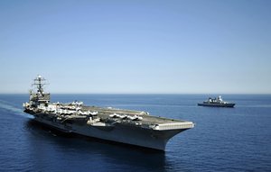 US Navy 100605-N-6003P-098 The German navy frigate FGS Hessen (F221) is underway alongside the Nimitz-class aircraft carrier USS Harry S. Truman (CVN 75) during interoperability operations