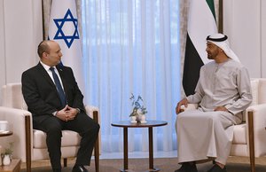 In this photo provided by the Israel Government Press Office (GPO), Israeli Prime Minister Naftali Bennett, left, meet Abu Dhabi Crown Prince Sheikh Mohammed bin Zayed at his private palace in Abu Dhabi, Monday, Dec. 13, 2021