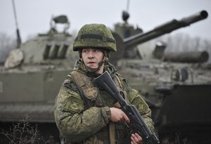 A Russian army soldier takes part in drills at the Kadamovskiy firing range in the Rostov region in southern Russia, Friday, Dec. 10, 2021