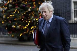 Britain's Prime Minister Boris Johnson walks across Downing Street to attend a cabinet meeting in London, Tuesday, Dec. 1, 2020.