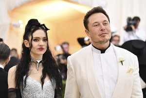 Grimes, left, and Elon Musk attend The Metropolitan Museum of Art's Costume Institute benefit gala in New York on May 7, 2018