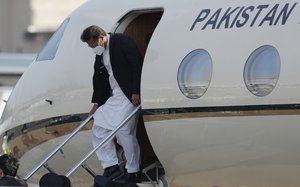 Pakistan Prime Minister Imran Khan disembarks from an airplane after his arrival in Colombo, Sri Lanka, Tuesday, Feb. 23, 2021.