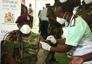 Malawi Army Commander Vincent Nundwe receiving his AstraZeneca COVID-19 vaccine in Zomba, Malawi, Thursday, March 11, 2021