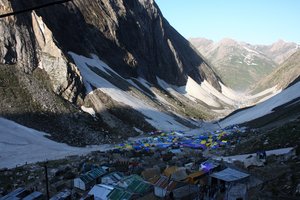 Thousands of tents are installed for Hindu pilgrims during Amarnath Pilgrimage, one of the most revered of Hindu shrines on July 01, 2011. near Baltal, Jammu and Kashmir, India. More than 5,000 Hindu devotees, braving sub-zero temperatures, began the hike over glaciers and along paths overhanging gorges to reach the sacred Amarnath cave housing an ice stalagmite, a stylized phallus worshiped by Hindus as a symbol of the god Shiva, enveloped by the rugged Himalayan mountains. The Kashmiri mountains near Srinagar are 3,800 metres above sea level and are home to an ice stalagmite resembling the Hindu god Shiva. About 200,000 Hindu pilgrims are expected to take part in this year's two-month pilgrimage, during which large numbers of Indian paramilitary soldiers and policemen are being deployed along the route as protection from attacks by militants who have been fighting for independence of Kashmir since 1989. Experts of the Indian National Geophysical Research Institute say rising temperatures and the activities of the pilgrims, such as burning wood and using diesel generators have put a lot of pressure on the ecosystem of the area.