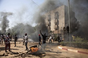 File - Protestors take to the streets of Burkina Faso's capital Ouagadougou Saturday Nov. 27, 2021, calling for President Roch Marc Christian Kabore to resign. The protest comes after the deadliest attack in years against the security forces in the Sahel's Soum province earlier this month, where more than 50 security forces were killed.