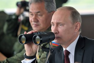 Putin Vladimir looking in binoculars, November 29, 2015.