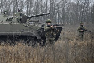 Russian troops take part in drills at the Kadamovskiy firing range in the Rostov region in southern Russia, Friday, Dec. 10, 2021