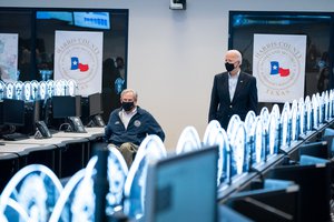 Joe Biden walks with Texas Gov. Greg Abbott Friday, Feb. 26, 2021, at the Harris County Emergency Operations Center in Houston