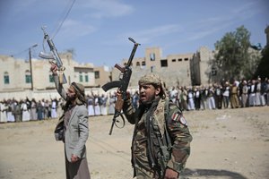 Armed Houthi fighters attend the funeral procession of Houthi rebel fighters who were killed in recent fighting with forces of Yemen's internationally recognized government, in Sanaa, Yemen, Wednesday, Nov. 24, 2021