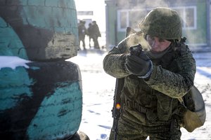 A Russian soldier takes part in drills at the Kadamovskiy firing range in the Rostov region in southern Russia, Wednesday, Dec. 22, 2021