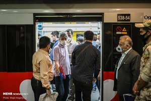 People wear protective mask to help prevent coronavirus in a metro station, in Tehran, Iran