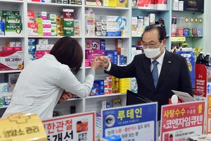 Official visiting pharmacy during Coronavirus (covid-19) outbreak in South Korea