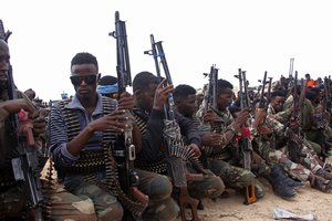 Military forces supporting anti-government opposition groups display their weapons in Mogadishu, Somalia Friday, May 7, 2021.