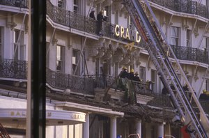 File - Emergency services and rescue workers on the balconies outside of the Grand Hotel in Brighton, England on Oct. 12, 1984, following an IRA bomb explosion.