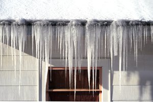 Long icicles hang from a house where nearly a foot of snow fell over the weekend, Monday, Dec. 27, 2021, in Bellingham, Wash. Sunday's snow showers blew into the Pacific Northwest from the Gulf of Alaska, dumping up to 6 inches across the Seattle area.